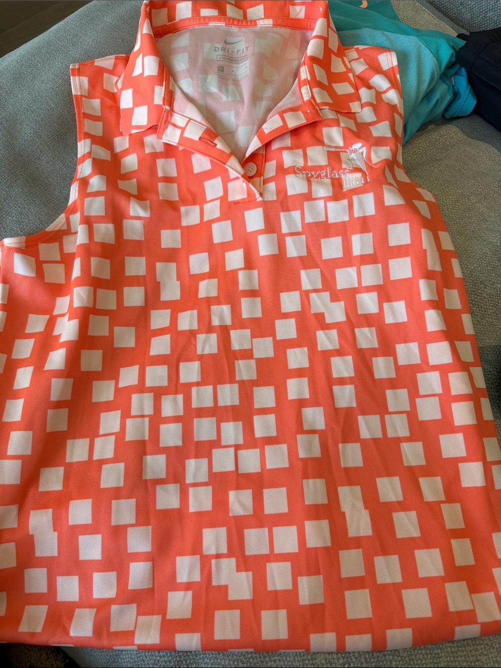 Nike Coral and White Sleeveless Golf Polo